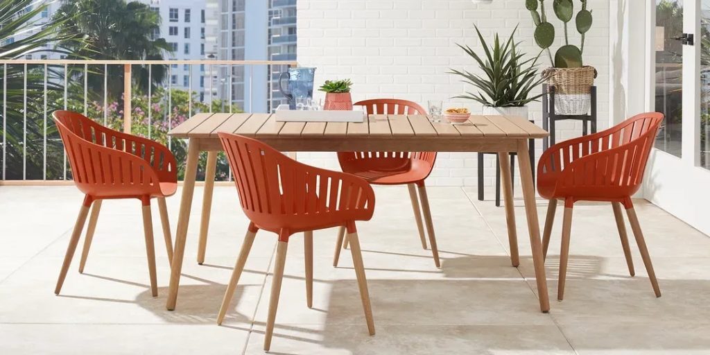 mid-century modern dining set with orange chairs